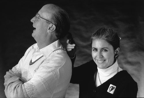 A black-and-white photograph of a man and a woman posing together